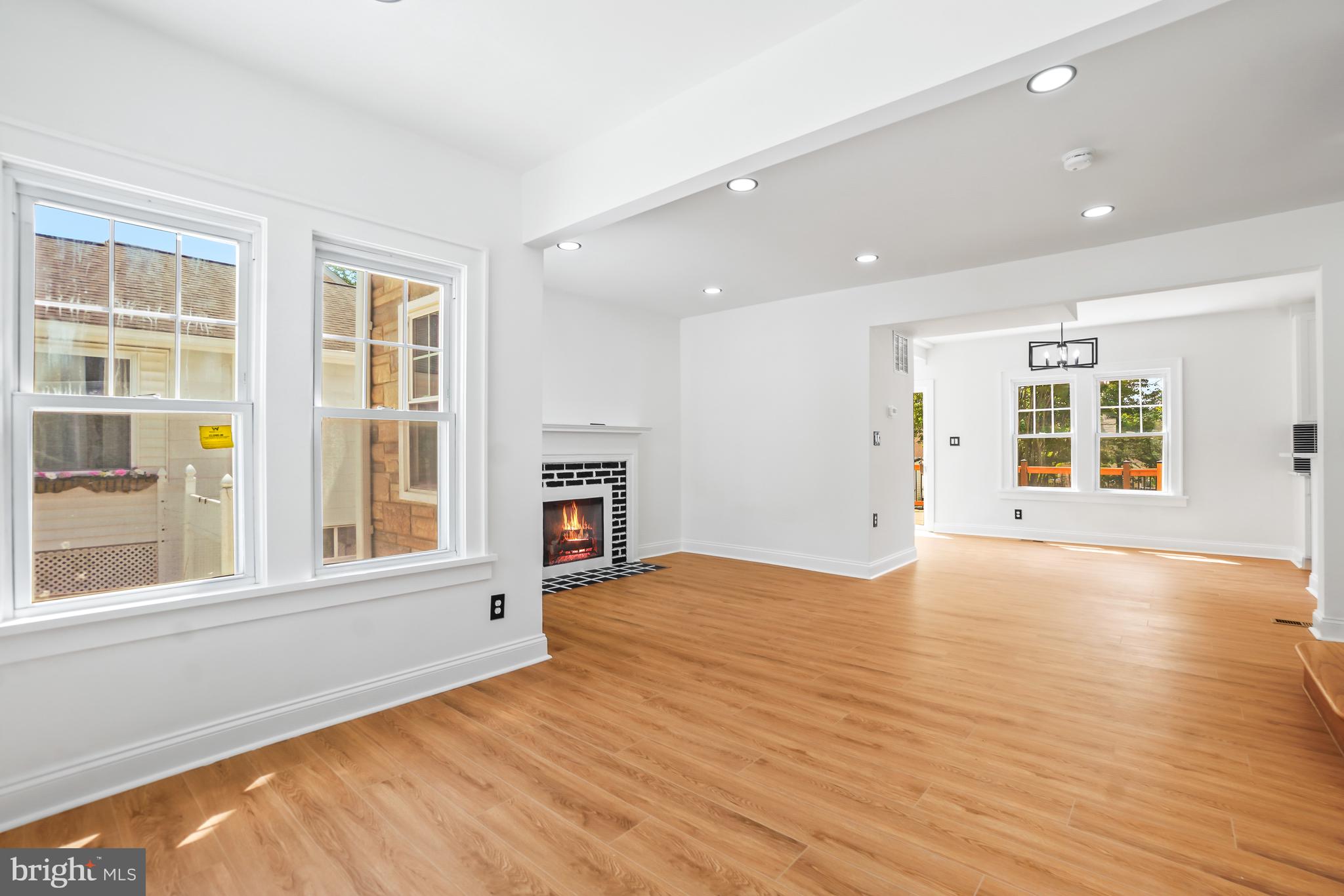 5309 Chesapeake Road Hyattsville, MD 20781 - Photo 7 of 36 an empty room with wooden floor and windows