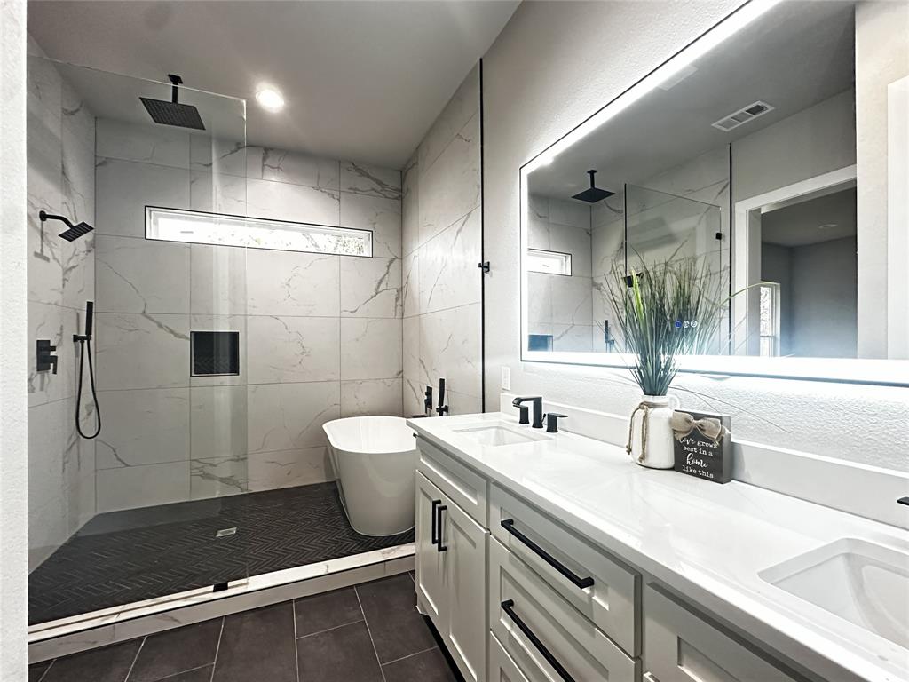 2770 Moffatt Avenue Dallas, TX 75216 - Photo 11 of 25 a bathroom with a double vanity sink mirror and shower