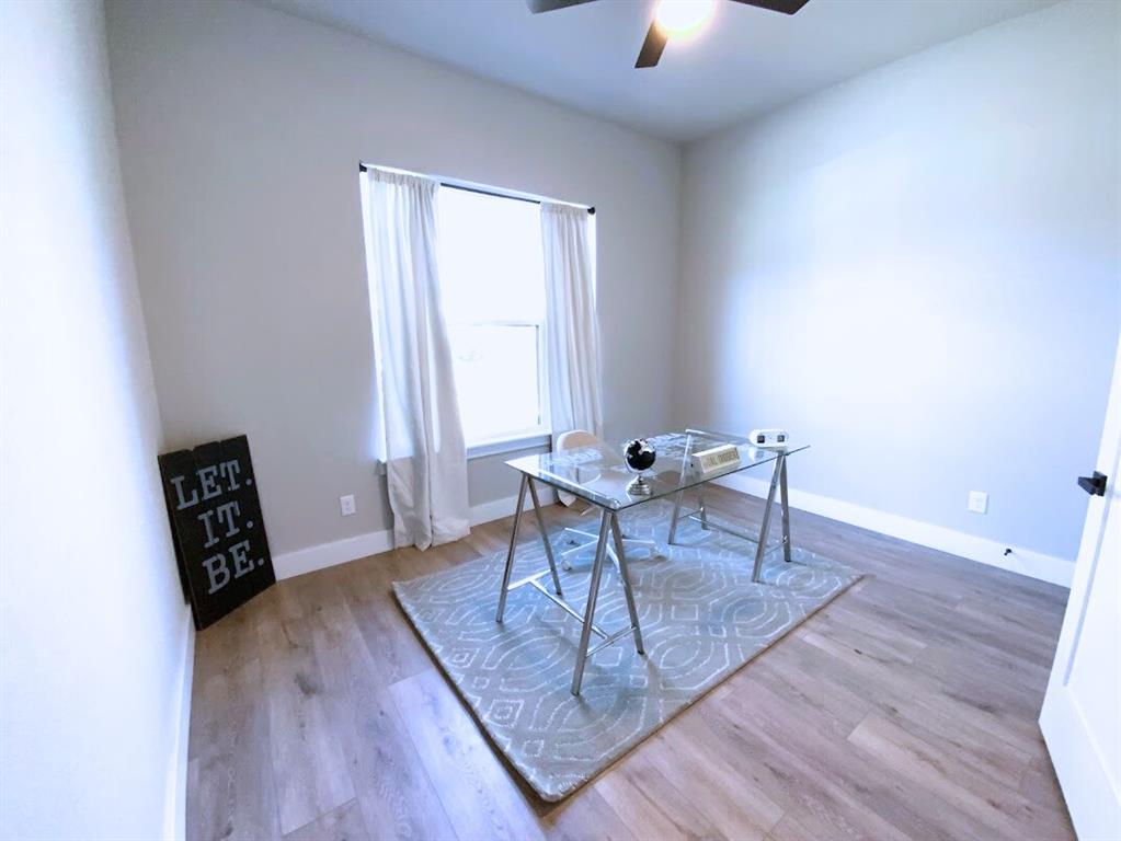 2770 Moffatt Avenue Dallas, TX 75216 - Photo 14 of 25 a living room with furniture and a wooden floor