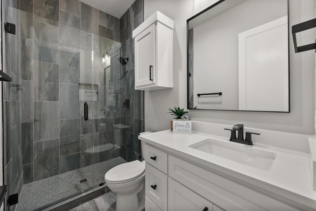 2770 Moffatt Avenue Dallas, TX 75216 - Photo 15 of 25 a bathroom with a sink toilet and shower