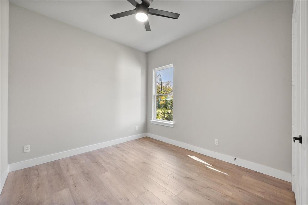 2770 Moffatt Avenue Dallas, TX 75216 - Photo 17 of 25 an empty room with a window and a fan