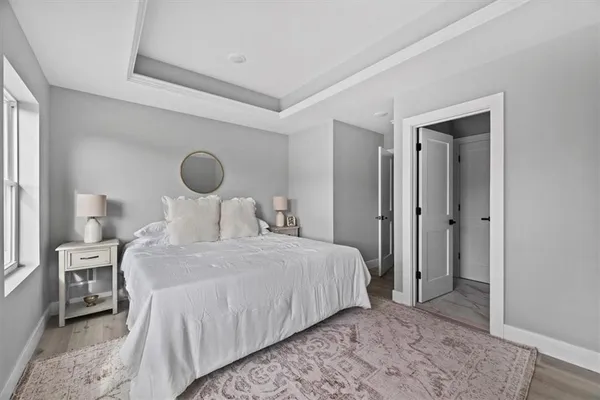 a bedroom with a bed and a dresser