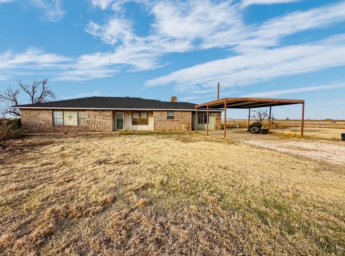 7811 Highway 86 Tulia, TX 79088 - Photo 1 of 19 a view of a house with yard and sitting area