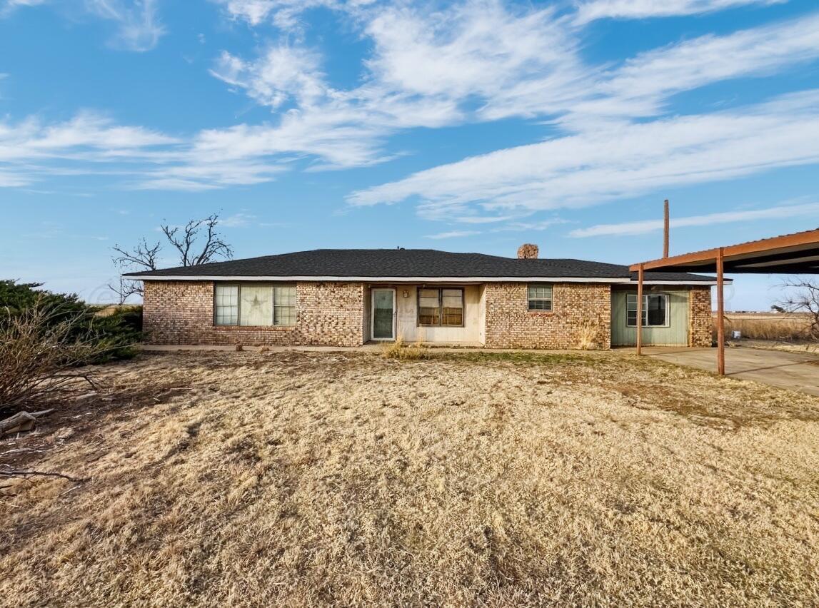 7811 Highway 86 Tulia, TX 79088 - Photo 2 of 19 a view of a house with a yard