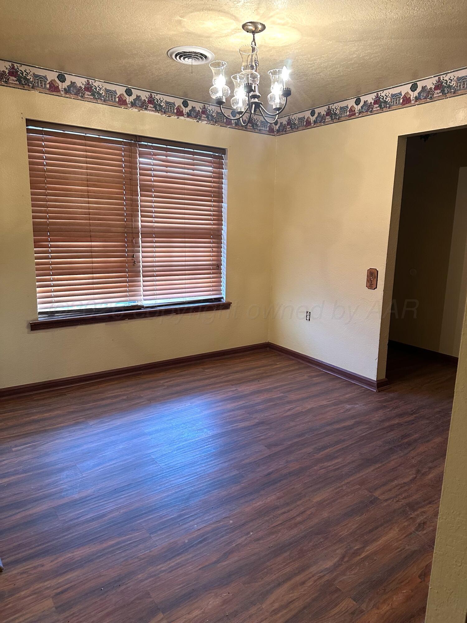 7811 Highway 86 Tulia, TX 79088 - Photo 9 of 19 a view of a room with wooden floor