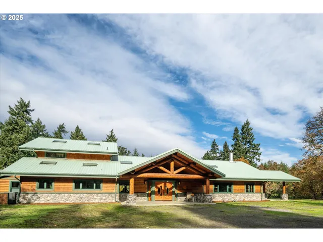 a view of a big house with a big yard and potted plants