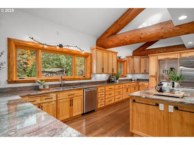 a kitchen with sink and cabinets