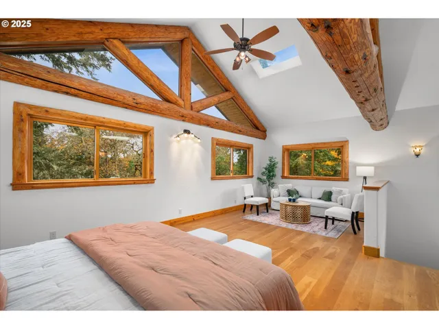 a living room with furniture a window and a table