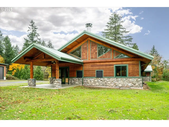 a view front of house with backyard and trees