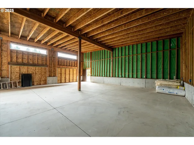 a house with huge green field in front of it
