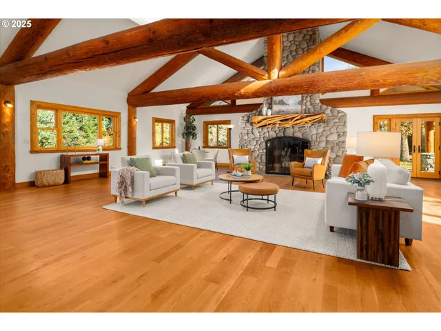 a living room with furniture a rug and a flat screen tv