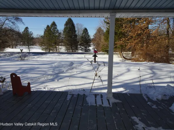 a view of swimming pool with outdoor seating