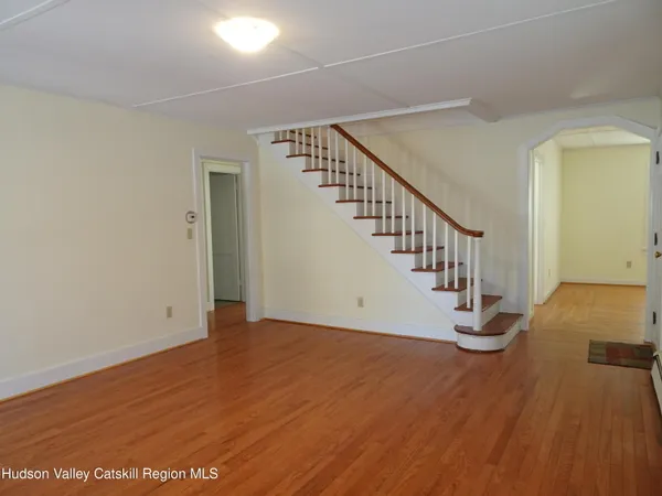 a view of entryway with wooden floor