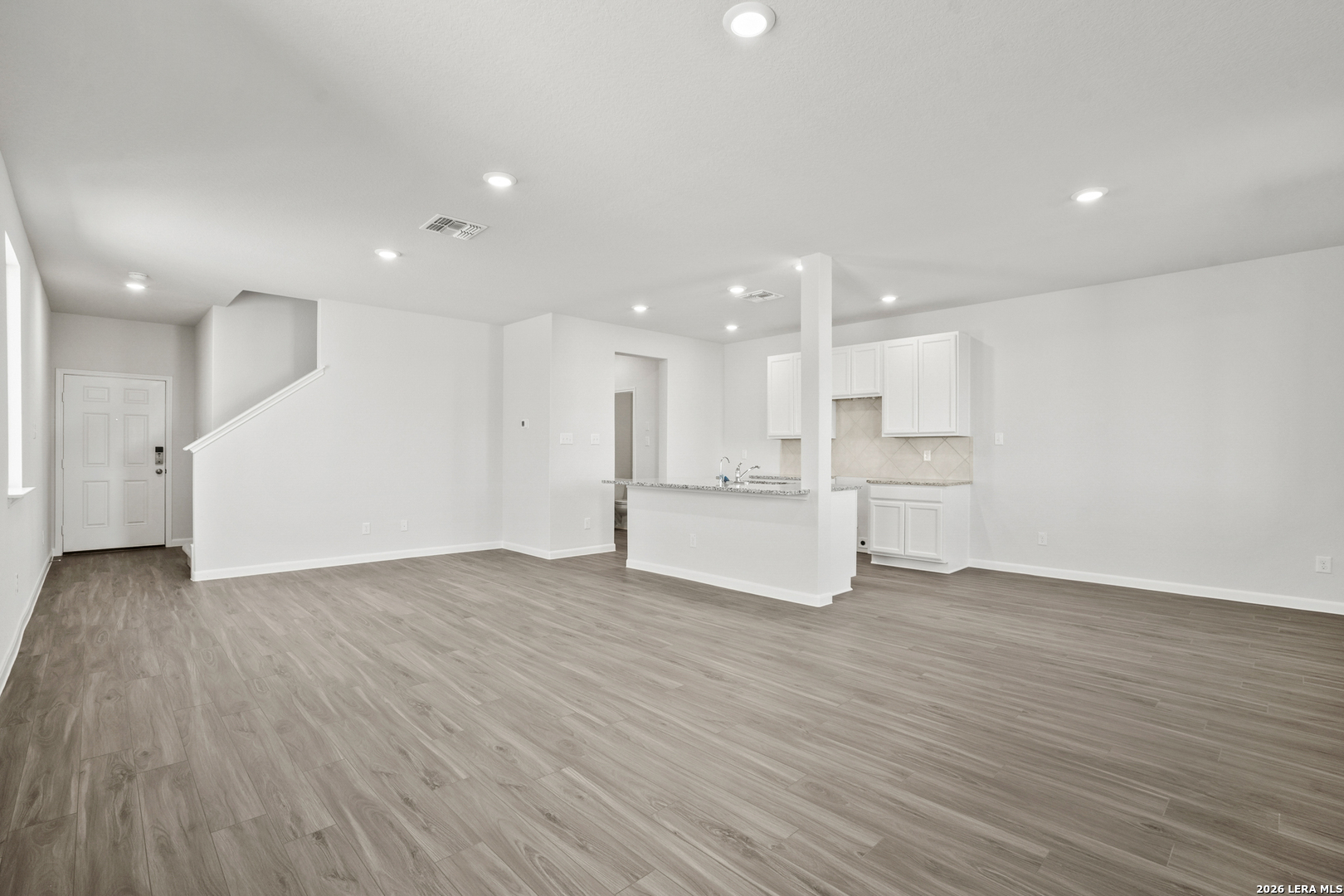11111 Luckenbach Loop Converse, TX 78109 - Photo 11 of 27 a view of kitchen with wooden floor