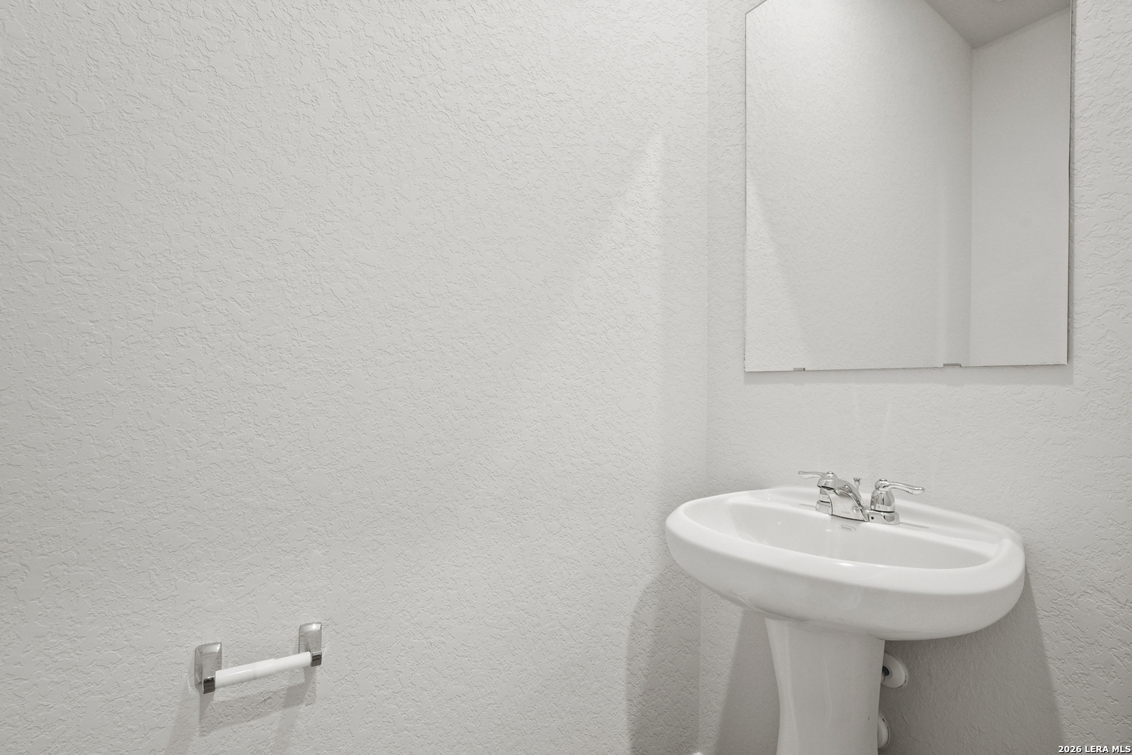 11111 Luckenbach Loop Converse, TX 78109 - Photo 12 of 27 a bathroom with a sink and a mirror