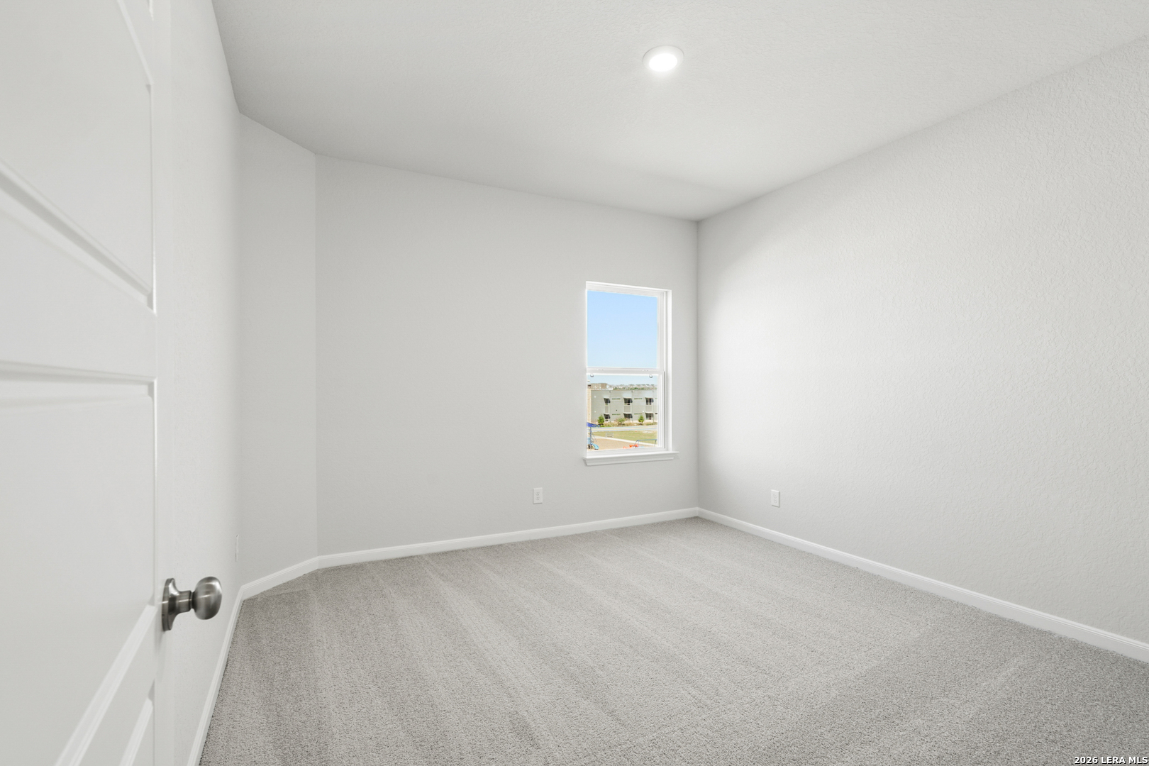 11111 Luckenbach Loop Converse, TX 78109 - Photo 15 of 27 an empty room with a window