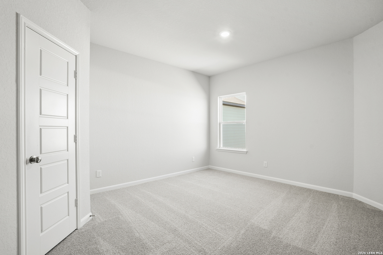 11111 Luckenbach Loop Converse, TX 78109 - Photo 19 of 27 an empty room with windows and closet