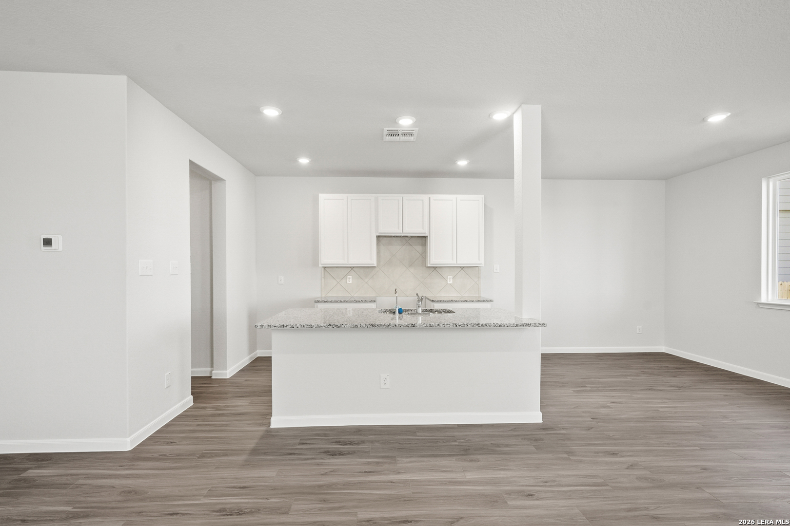 11111 Luckenbach Loop Converse, TX 78109 - Photo 2 of 27 a view of a kitchen with a sink and wooden floor