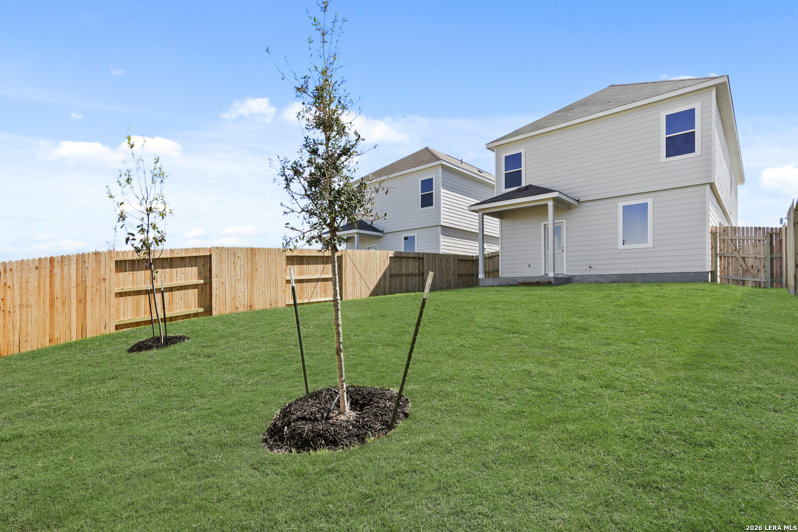 11111 Luckenbach Loop Converse, TX 78109 - Photo 25 of 27 a view of a house with a yard and a garden