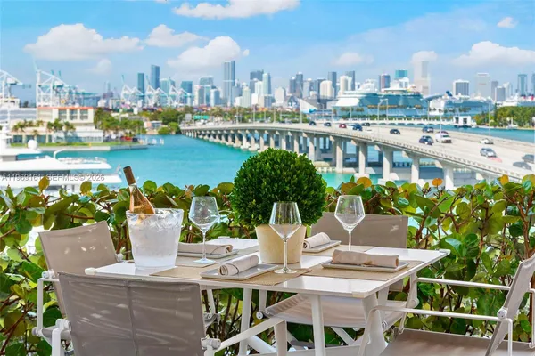 a view of a patio with a table chairs and a table