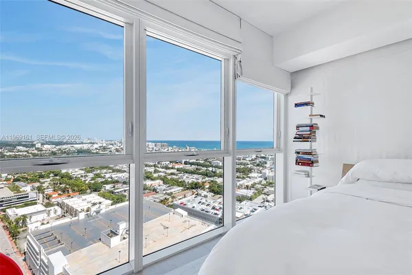a bed room with a bed and a window