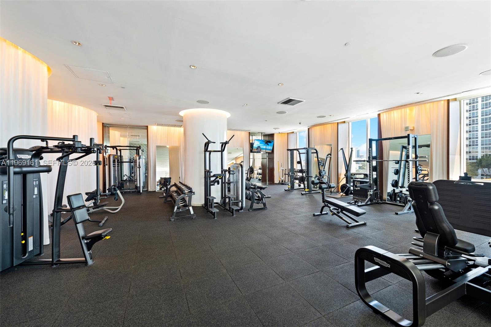 450 Alton Road, Unit 3208 Miami Beach, FL 33139 - Photo 24 of 43 a view of a room with gym equipment