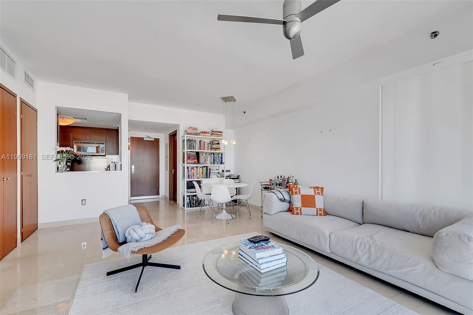 450 Alton Road, Unit 3208 Miami Beach, FL 33139 - Photo 7 of 43 a living room with furniture and wooden floor