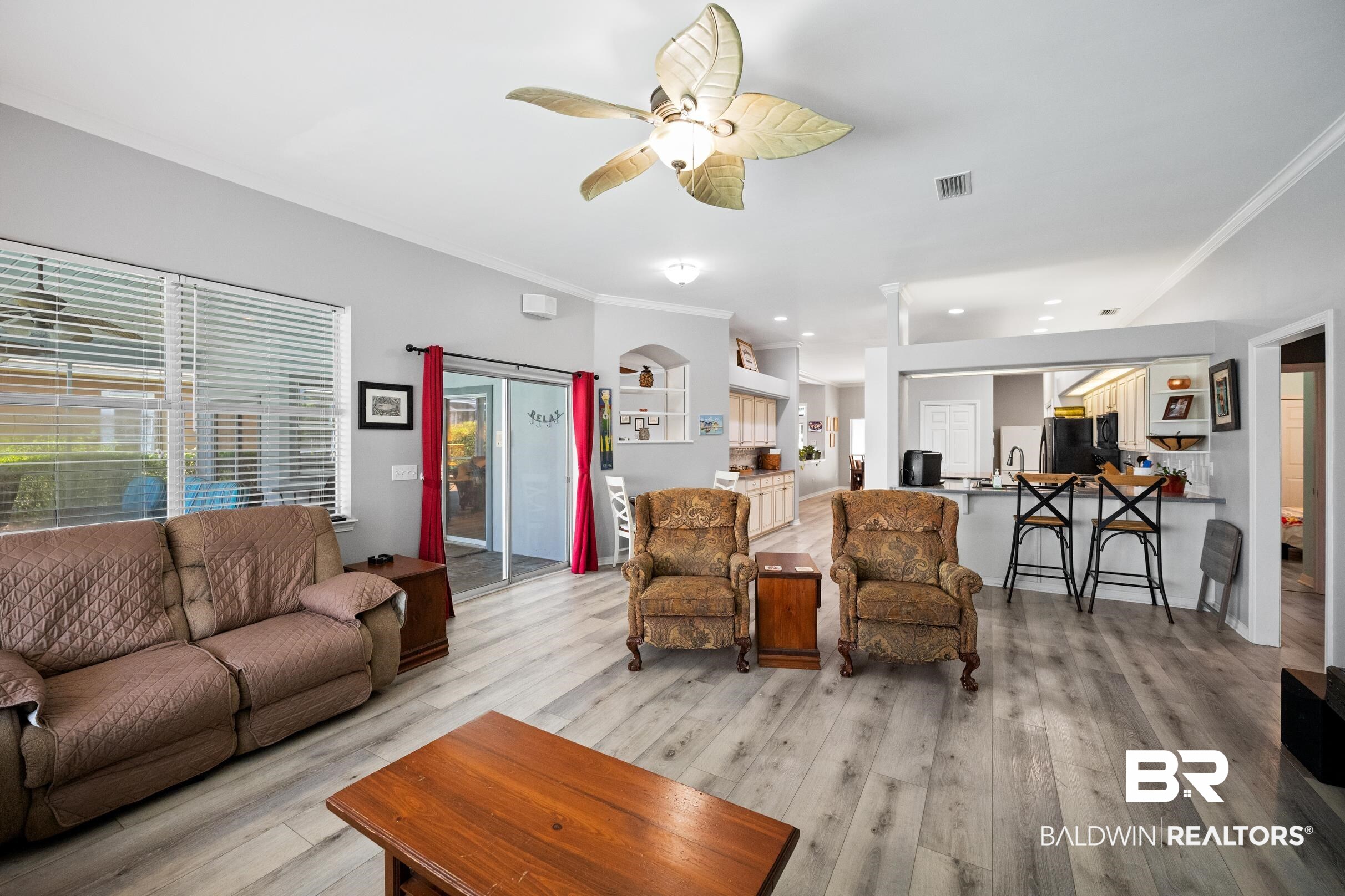8585 Bay Harbor Road Elberta, AL 36530 - Photo 12 of 51 Living room with light wood finished floors, a ceiling fan, ornamental molding, and recessed lighting