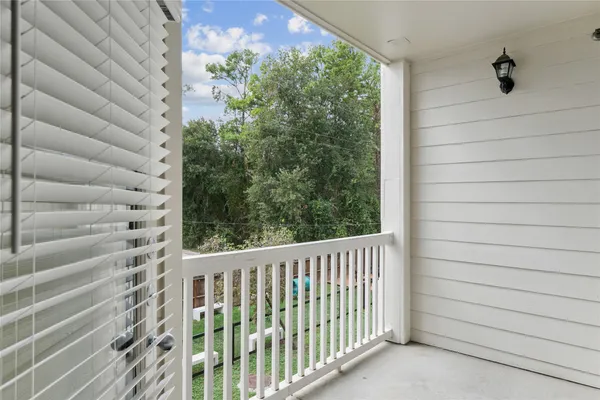 a view of a balcony with a plant