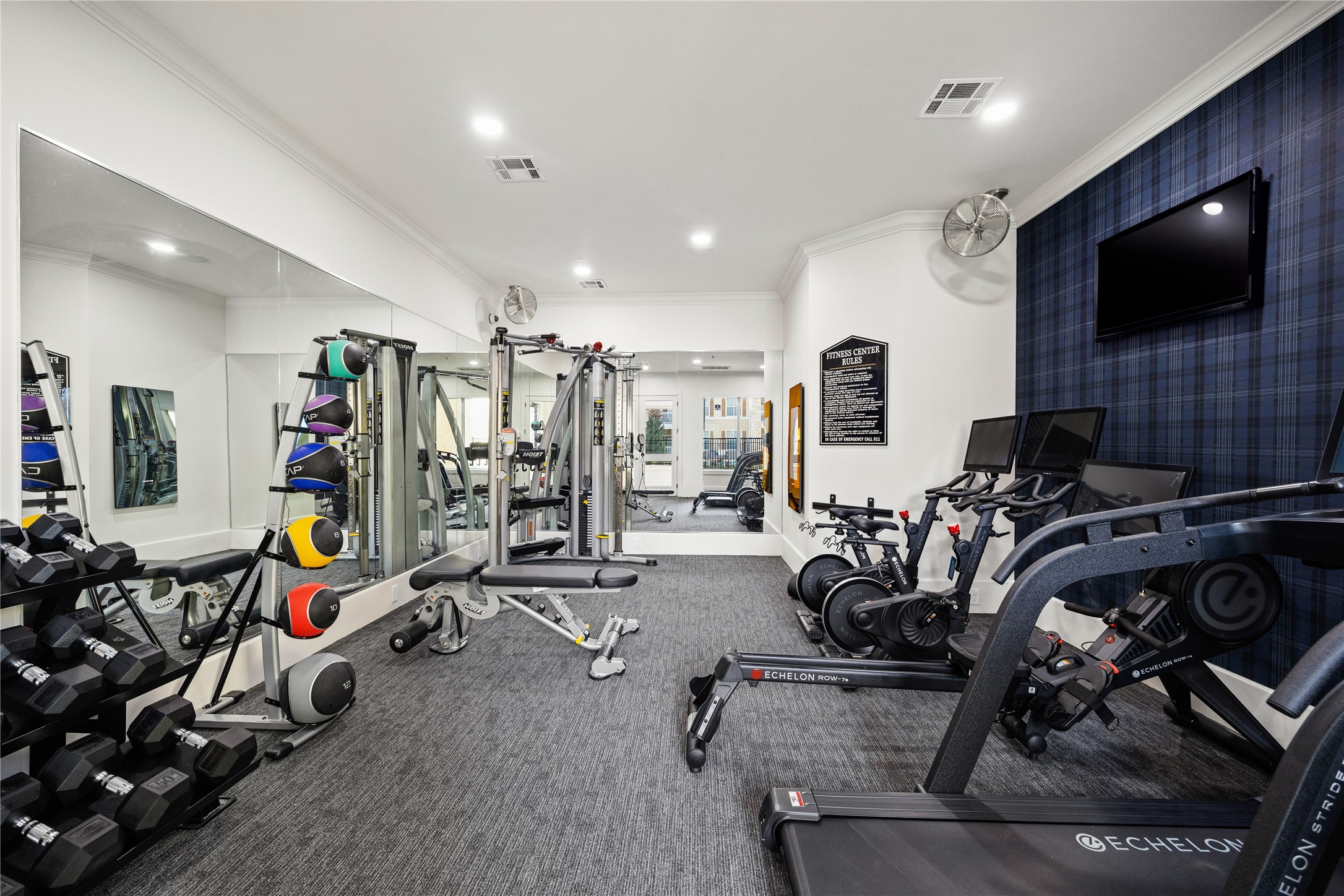 11925 Jones Road, Unit 2106 Houston, TX 77070 - Photo 6 of 21 a view of a room with gym equipment