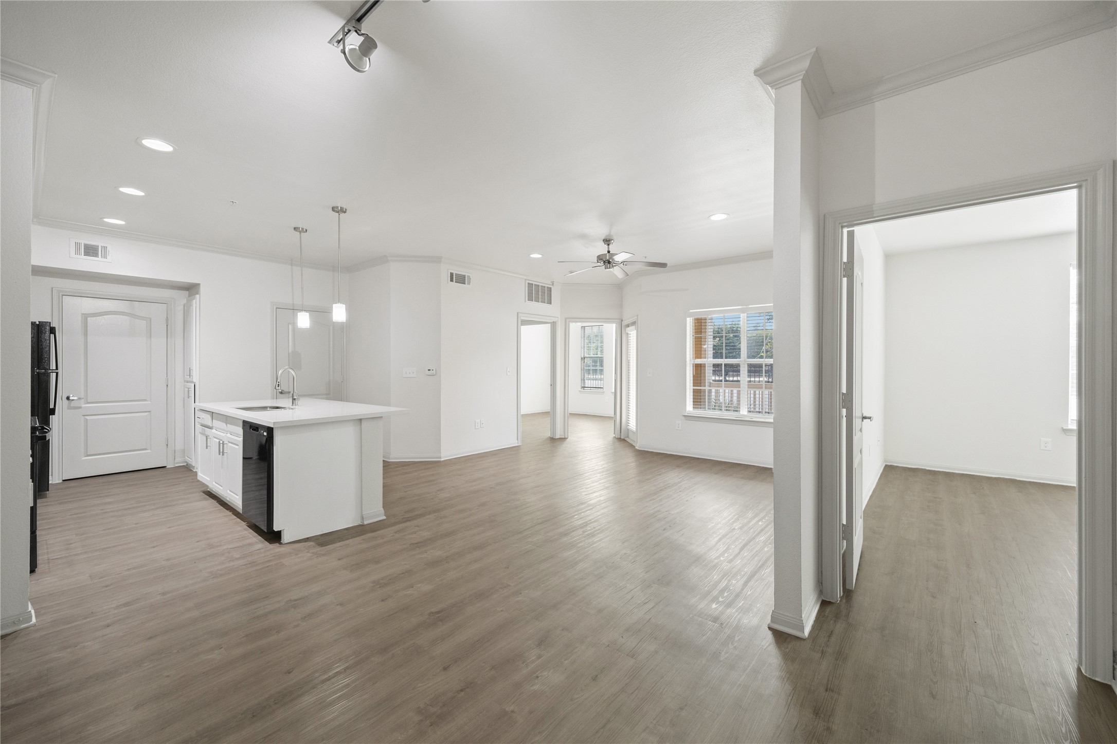 11925 Jones Road, Unit 2106 Houston, TX 77070 - Photo 8 of 21 a view of an empty room and kitchen with a sink
