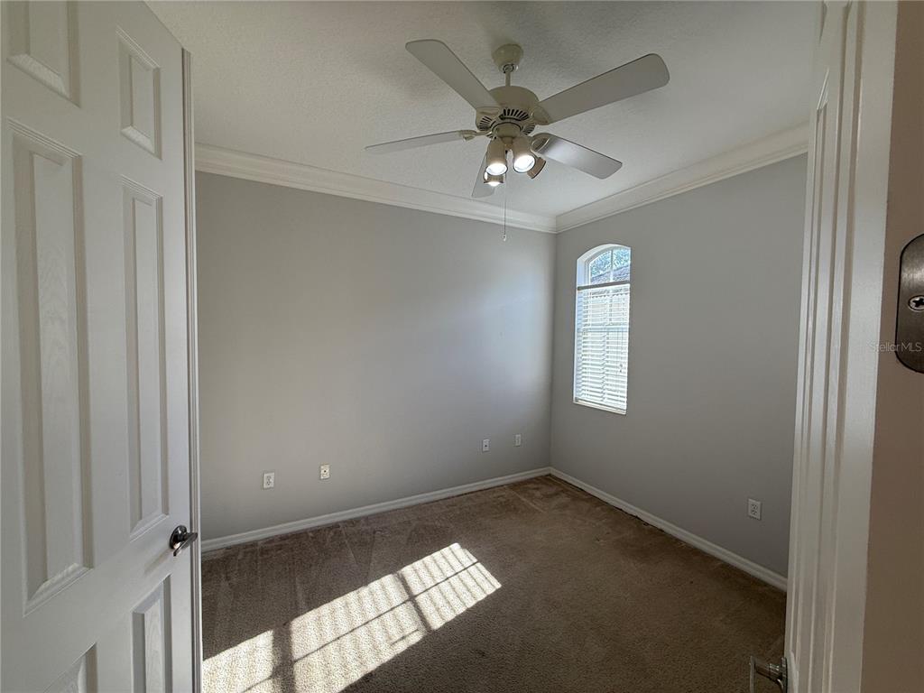 6055 Wingspan Way Bradenton, FL 34203 - Photo 14 of 32 a view of an empty room with a window