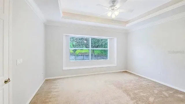 an empty room with an entryway and closet