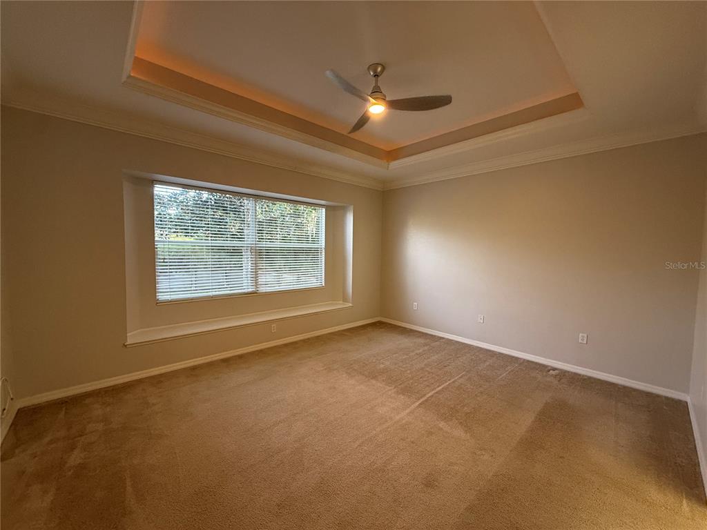 6055 Wingspan Way Bradenton, FL 34203 - Photo 18 of 32 a view of an empty room with a window