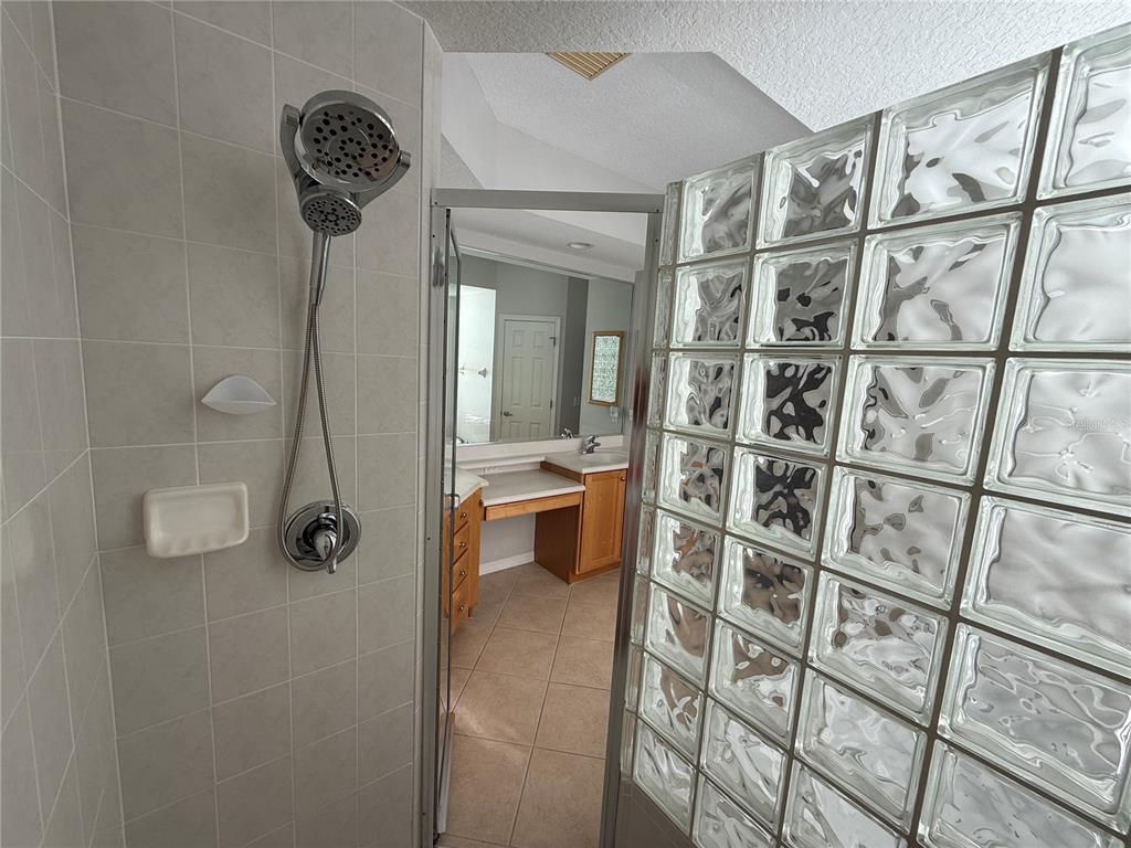 6055 Wingspan Way Bradenton, FL 34203 - Photo 22 of 32 a bathroom with a shower