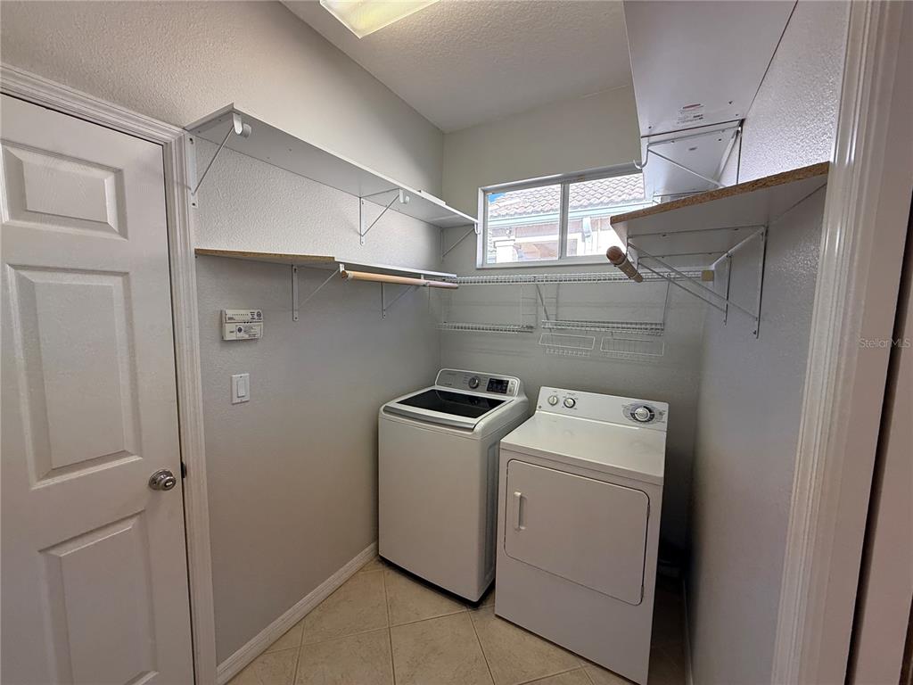 6055 Wingspan Way Bradenton, FL 34203 - Photo 28 of 32 a utility room with dryer and washer