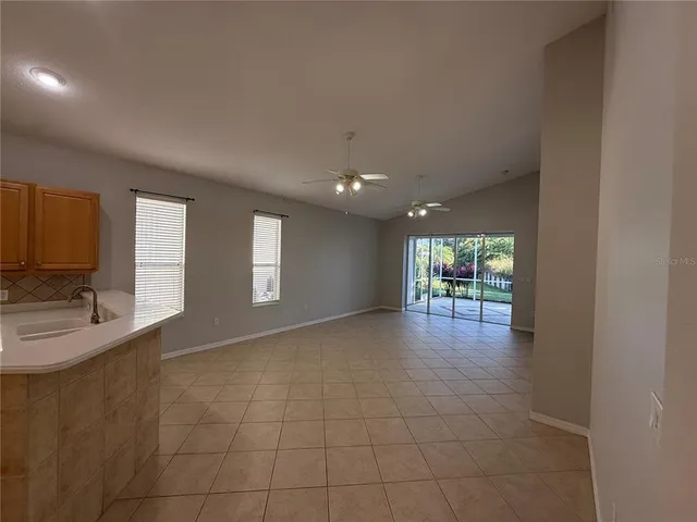a kitchen that has a lot of cabinets in it