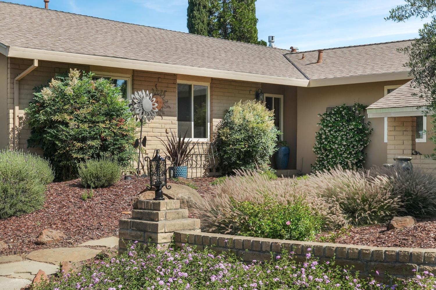 2276 El Cejo Circle Rancho Cordova, CA 95670 - Photo 2 of 41 Lovely front yard landscaping to welcome you and your guests, including a jasmine trellis near the front door beckoning with its lushly fragrant warm weather blooms!