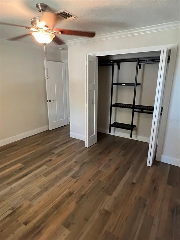 511 West Retta Esplanade Punta Gorda, FL 33950 - Photo 19 of 19 a view of a room with wooden floor closet and a ceiling fan