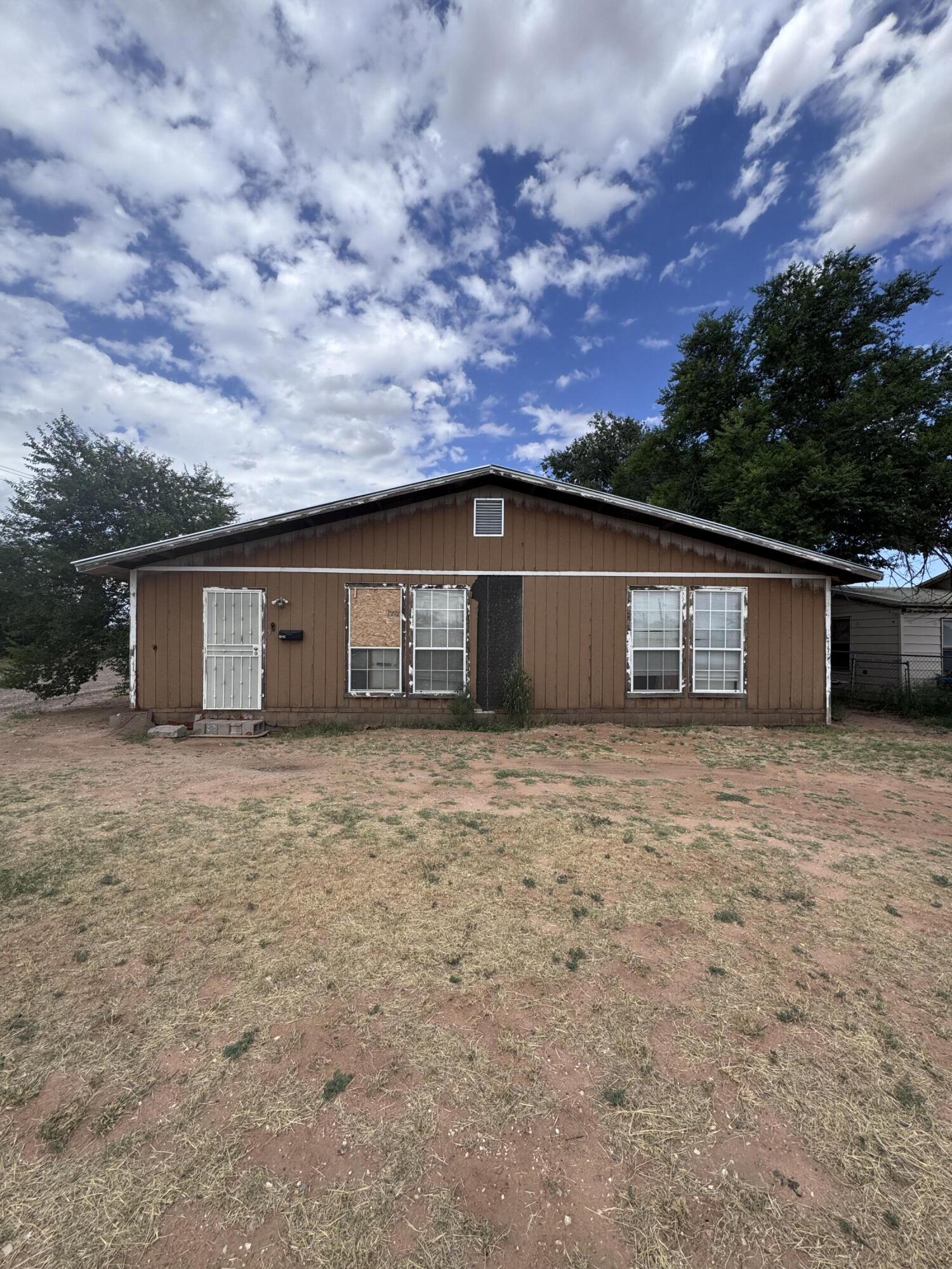 1401 South Canyon Avenue Lamesa, TX 79331 - Photo 1 of 32 a view of a house with a yard