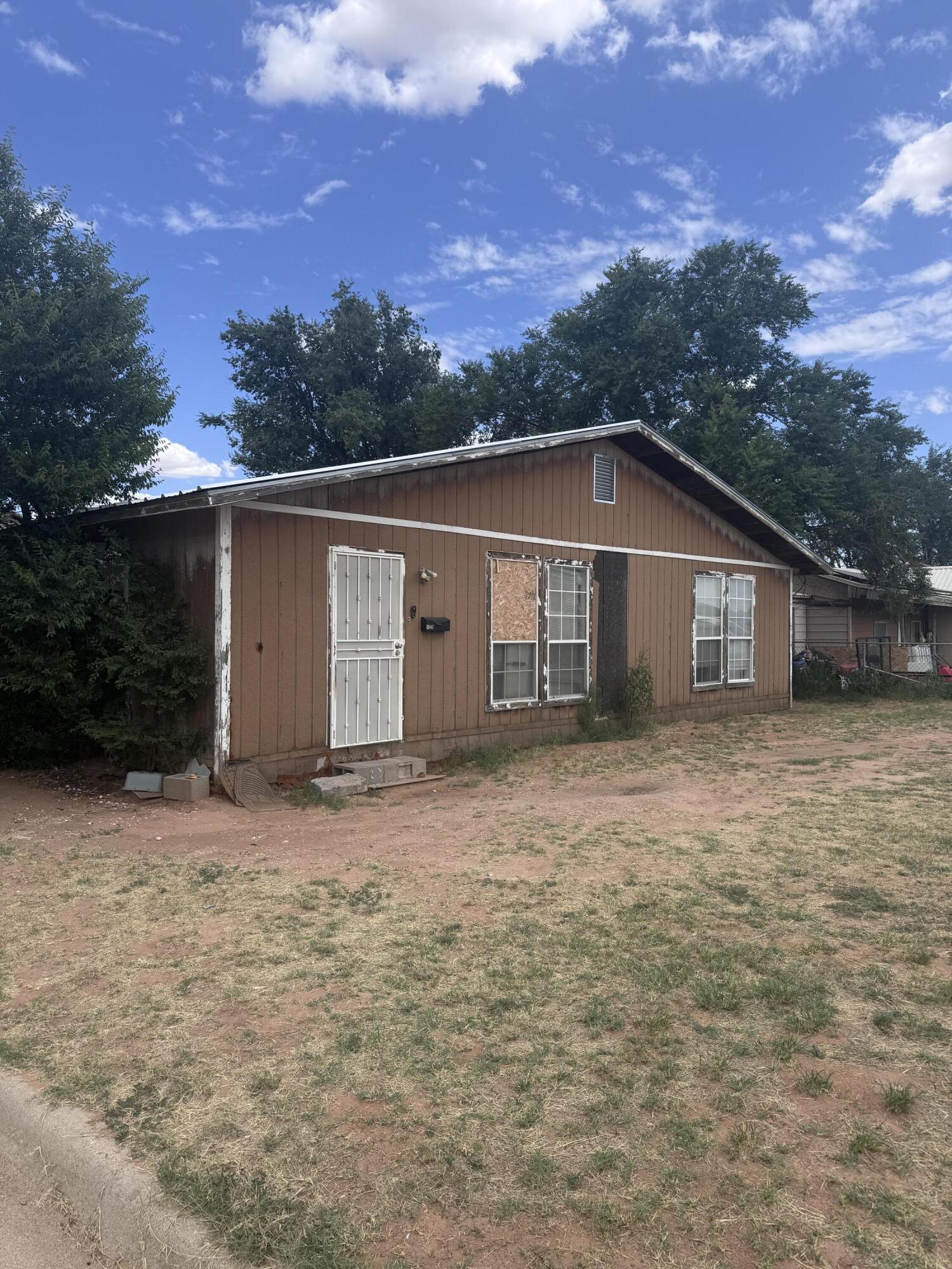 1401 South Canyon Avenue Lamesa, TX 79331 - Photo 2 of 32 front view of house with a yard