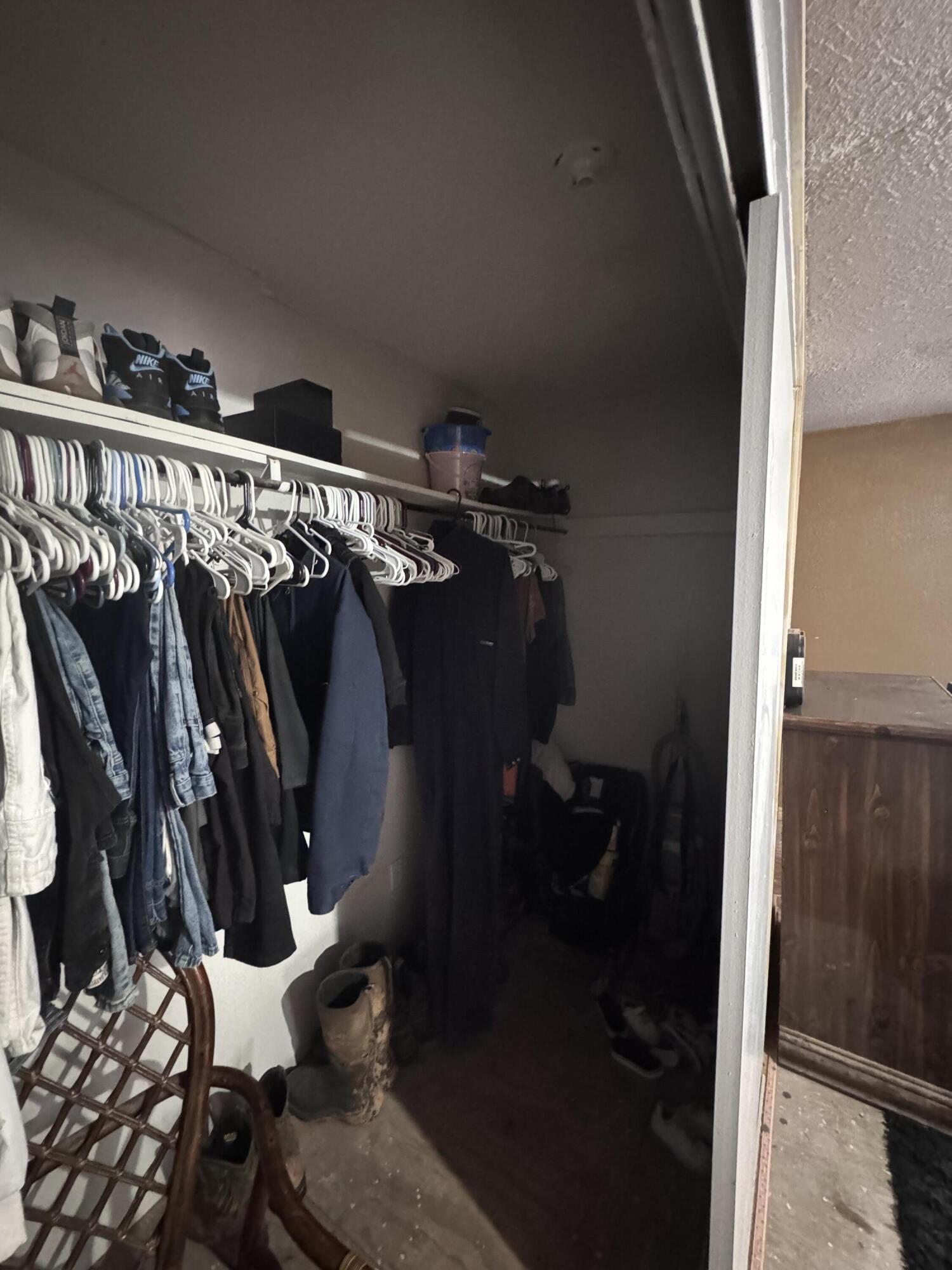 1401 South Canyon Avenue Lamesa, TX 79331 - Photo 27 of 32 a view of walk in closet with clothes and shoes