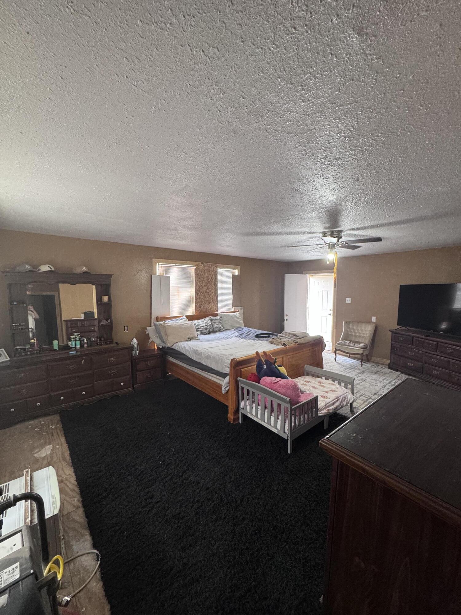 1401 South Canyon Avenue Lamesa, TX 79331 - Photo 29 of 32 a bedroom with bed and window