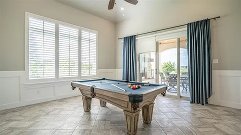 a dining room with a large window and table