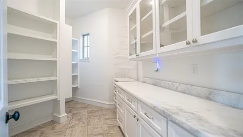 a kitchen with a refrigerator and a sink