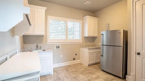 a large kitchen with a large window