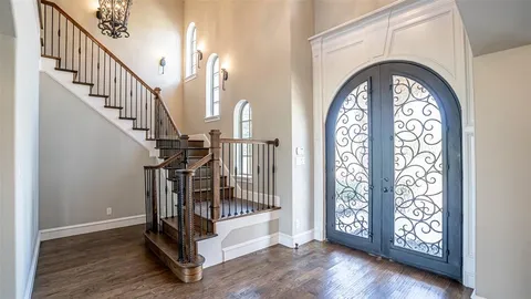a view of entryway with wooden floor
