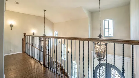 a view of staircase with wooden floor