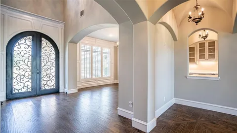a view of an entryway with wooden floor