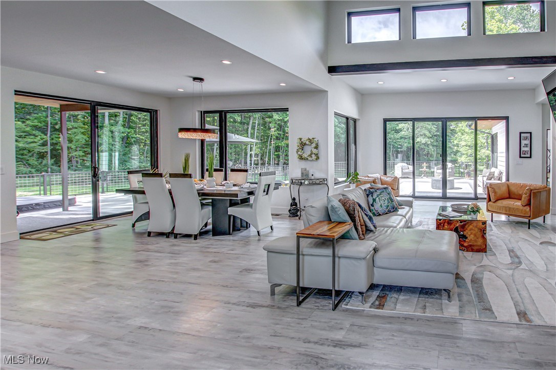 4385 Good Road Seville, OH 44273 - Photo 6 of 50 Great room with plenty of natural light, hardwood / wood-style floors, and a towering ceiling